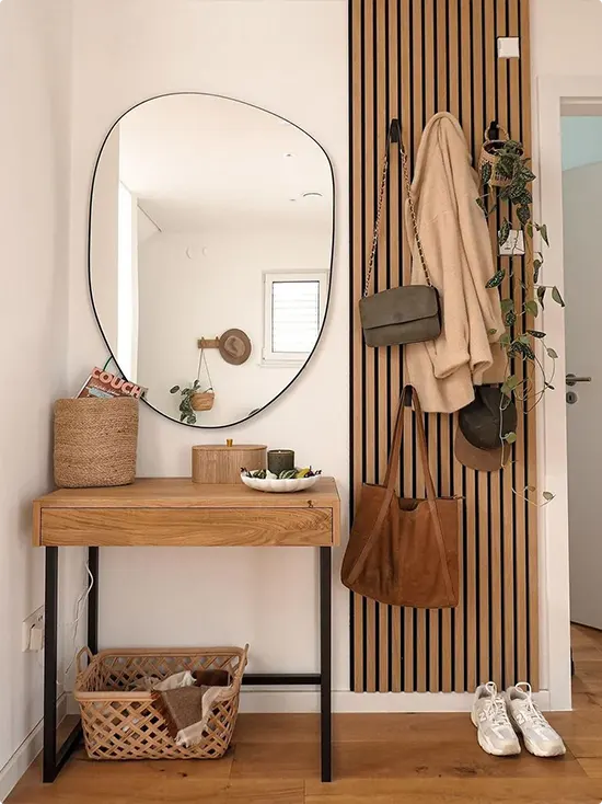 Vertical Slatted Wood Wall with Oval Mirror
