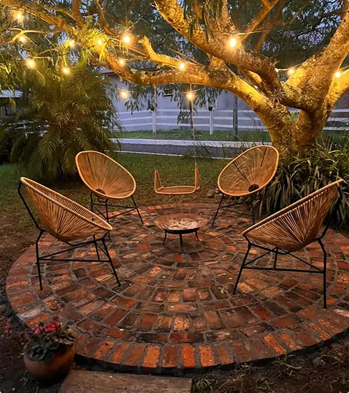 Brick Fire Pit Area with Overhead String Lights