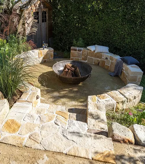 Fire Pit Below a Stone Bench