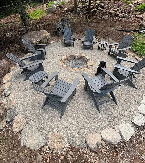 Gravel Fire Pit Area with Gray Adirondack Chairs