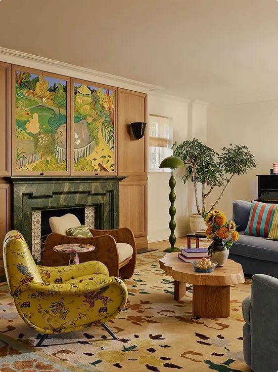 Green marble fireplace with a botanical mural