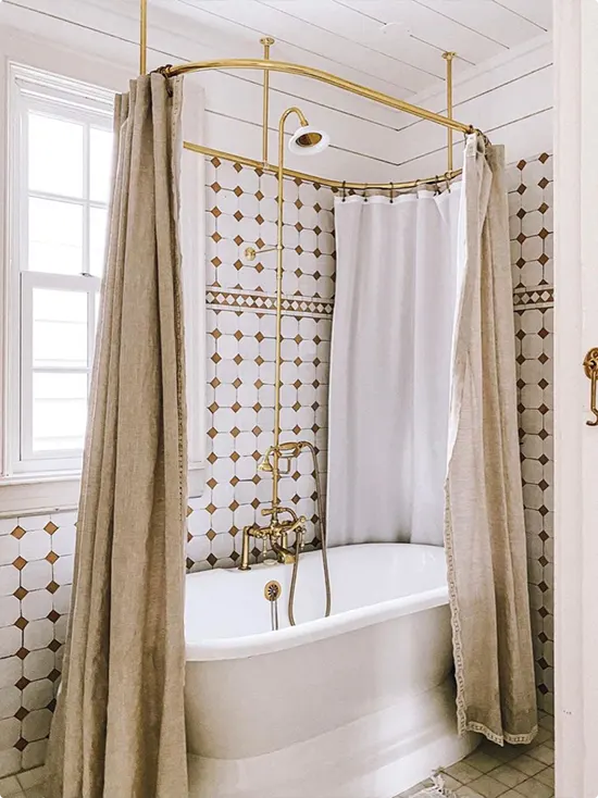 Linen Curtain and White Clawfoot Tub with Brown and White Diamond Tile
