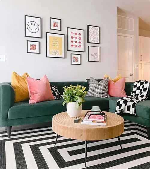 A Round Coffee Table Beneath the Gallery Wall