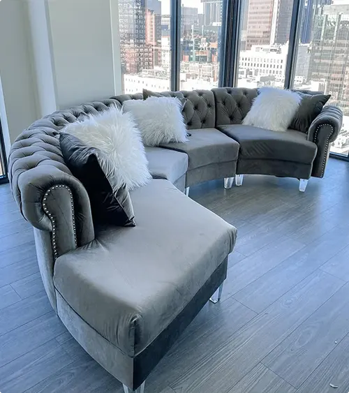 City views beside a tufted gray sectional