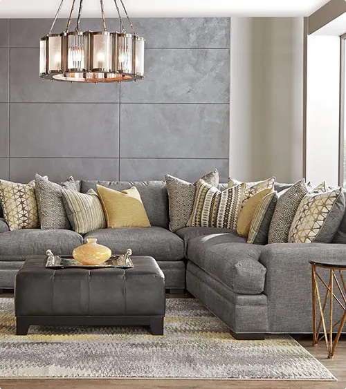 Concrete-Look Panels Behind a Large Sectional