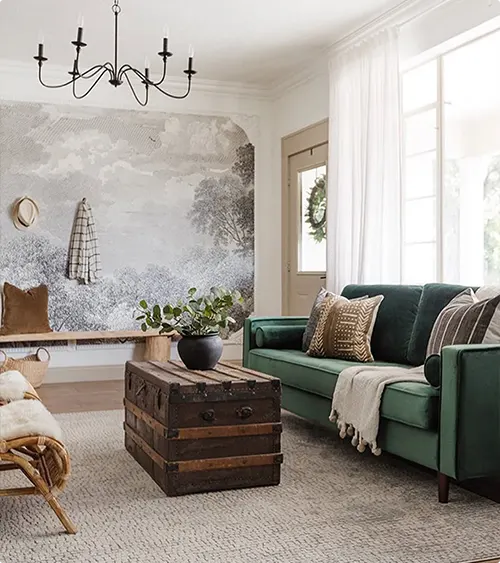 Green Couch with a Mural Wall and Vintage Trunk