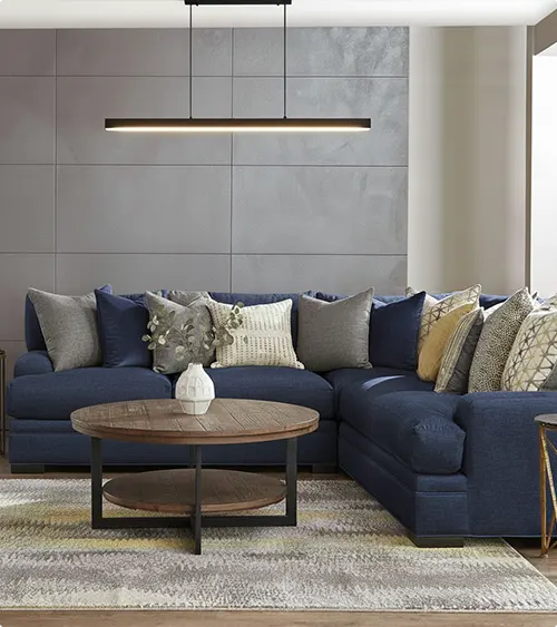 Navy Sectional with Gray Paneling and Linear Lighting