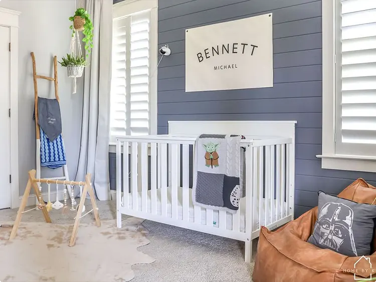 Nursery with a Shiplap Accent Wall and Personalized Name Sign