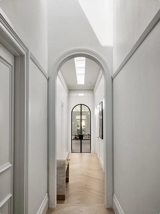 Arched Glass Door at Hallway End