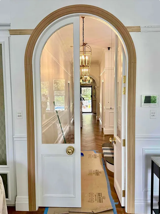Arched Wood Doorway with White Glass Doors