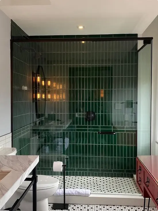Dark Green Vertical Shower with Black Frame Red Cabinet and Penny Tile