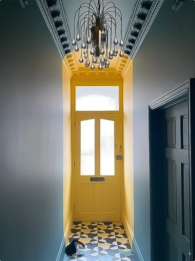 Entry with Sunny Yellow Door and Statement Lighting