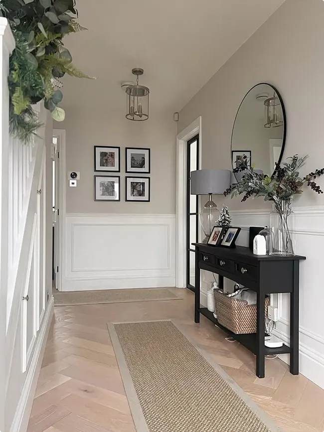 Wainscoted Hallway with a Black Console