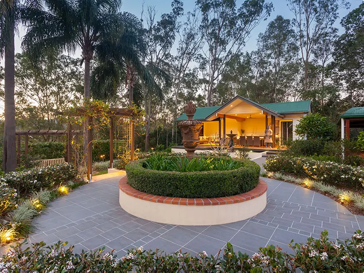 Circular Raised Hedge Courtyard at Dusk