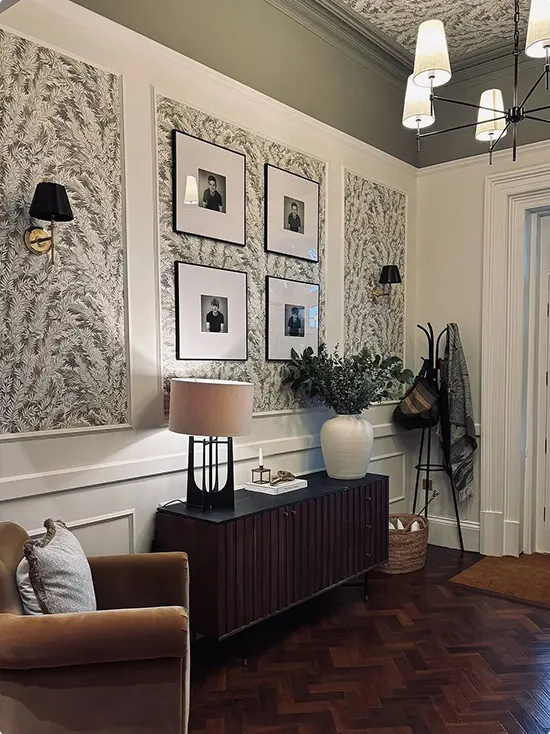 White Molded Art Panels Over Botanical Wallpaper