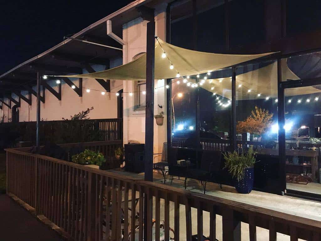 backyard-patio-lighting-ideas-josh_hywel backyard patio wood deck with shade and string lights