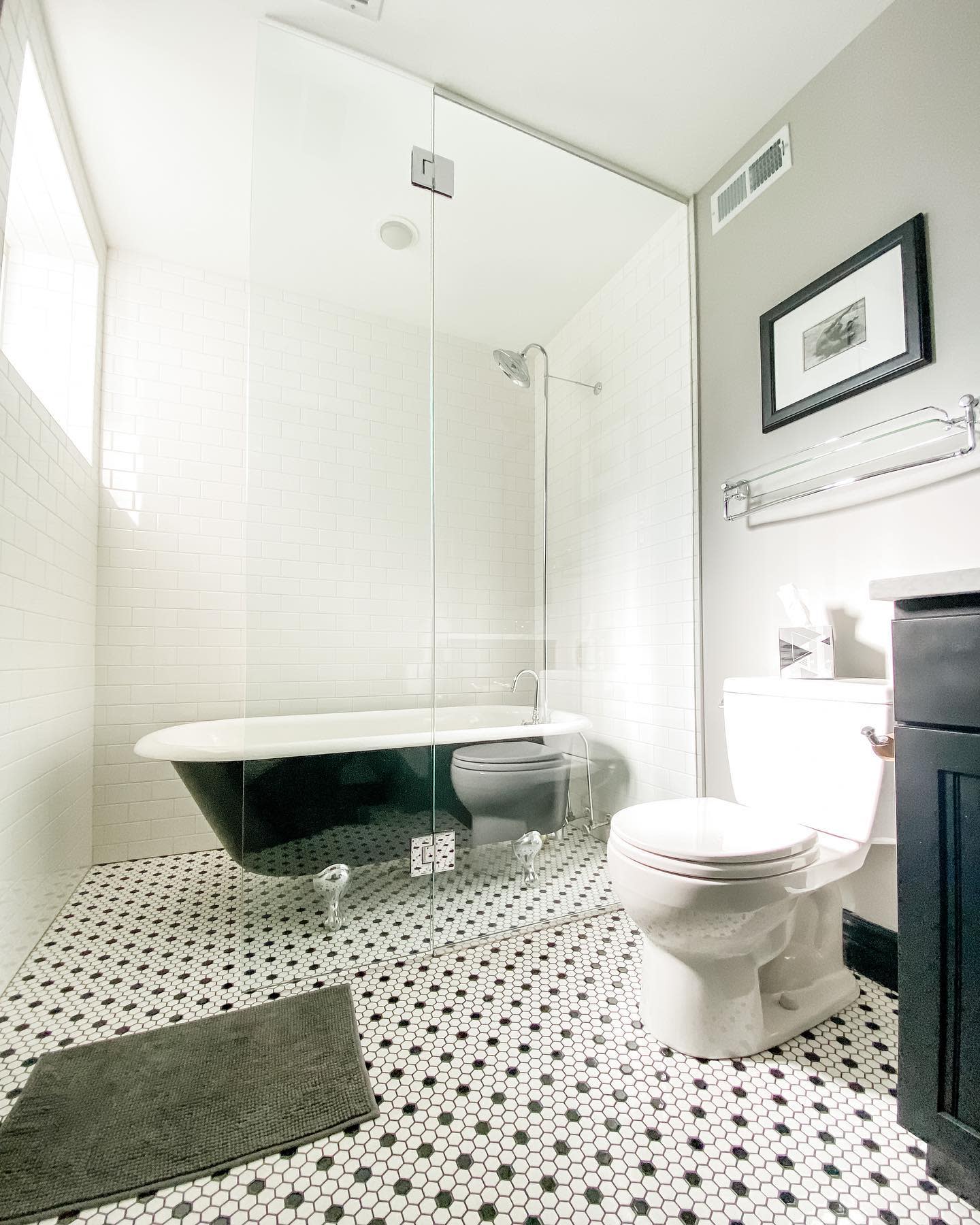 bathroom20basement20apartment20ideas20-my_victorian_rehab Contemporary bathroom with glass shower, clawfoot tub, and black-and-white tile flooring.