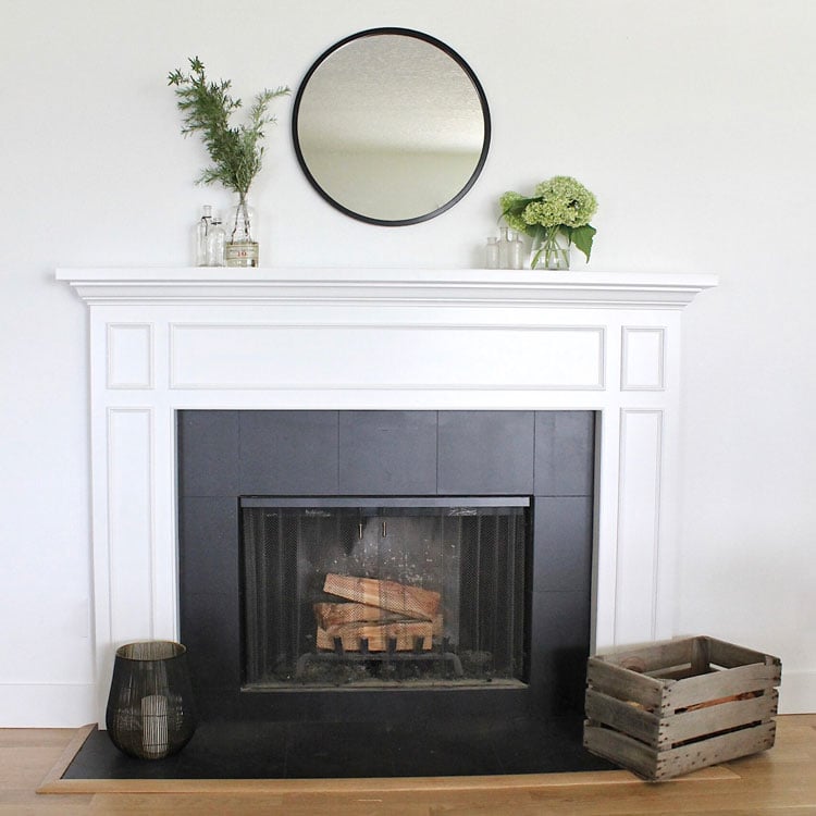 black-tiles-around-fireplace-with-white-surround Black Tiles Around Fireplace with White Surround