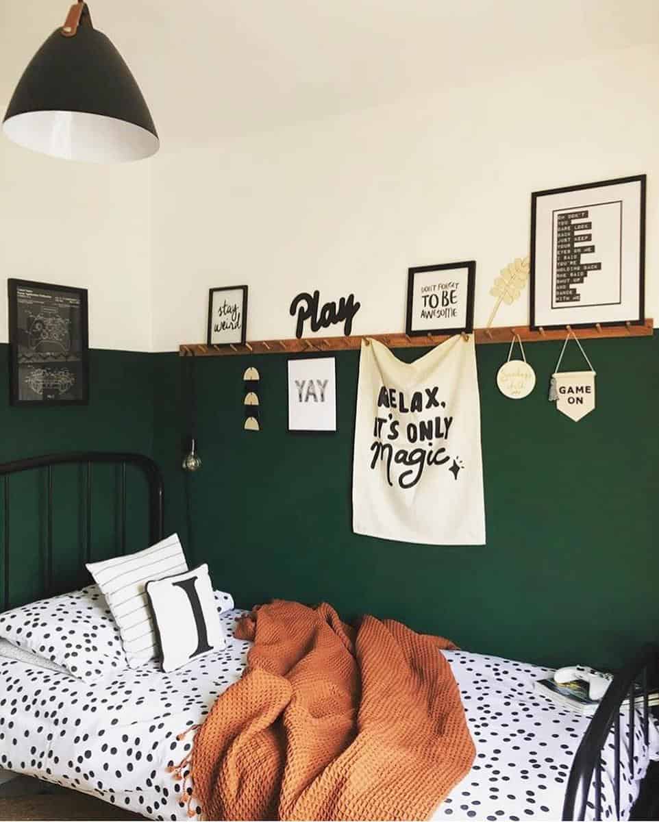 boy-green-bedroom-ideas-through_the_lane Cozy bedroom with green walls, wall art, a single bed with polka dot bedding, and a warm orange blanket
