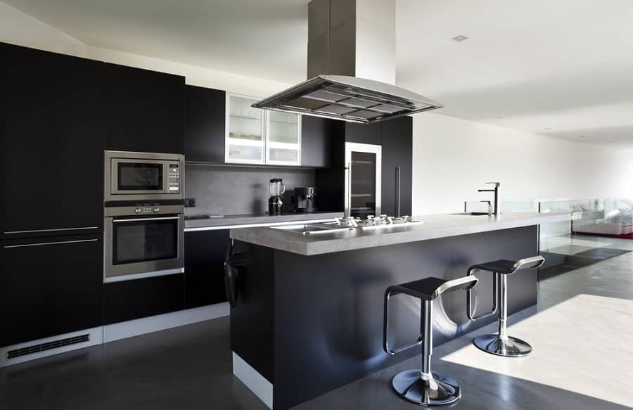 modern luxury kitchen with black cabinets and island