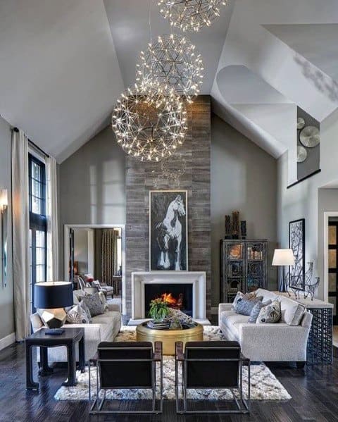 luxury living room with stone fireplace