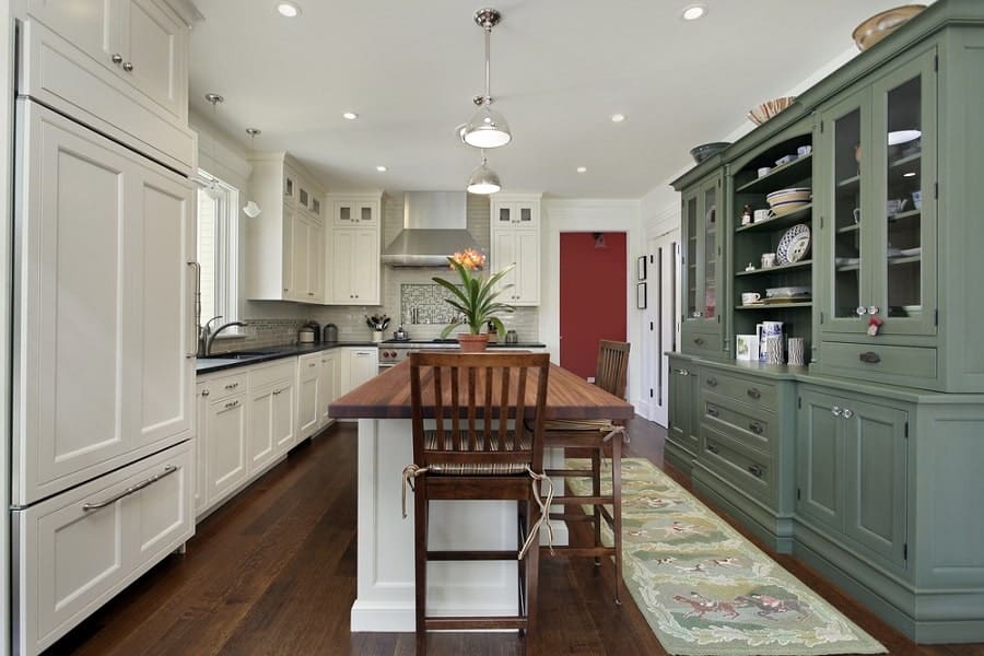 white and green cabinet kitchen with long island