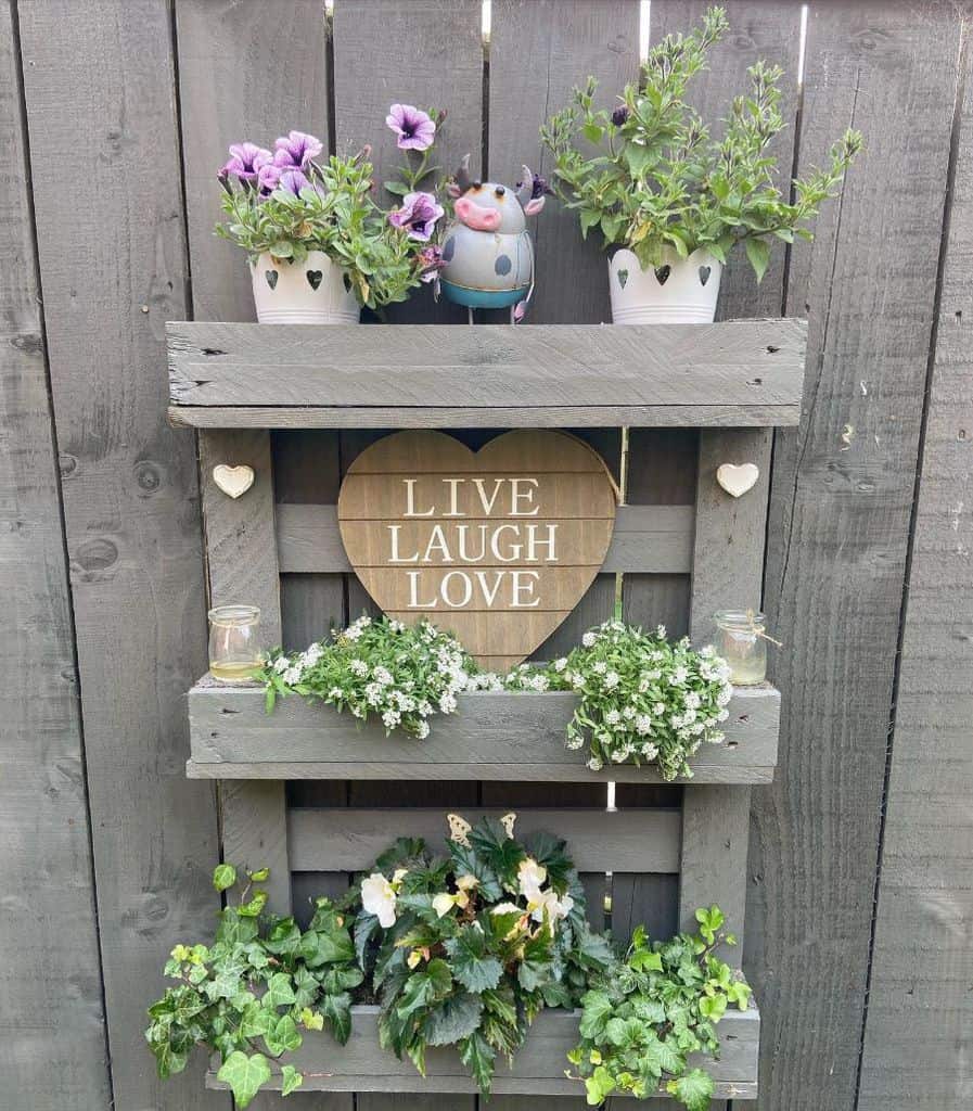 creative pallet garden design with pot plants