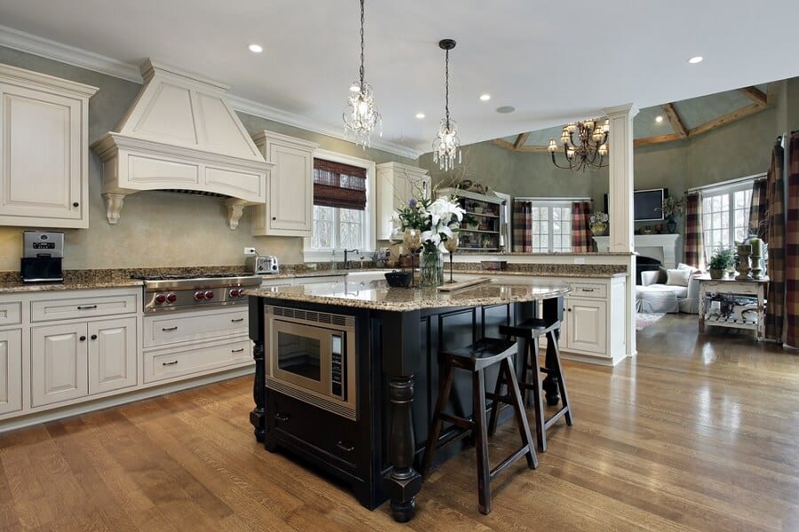 large farmhouse kitchen with black wood island