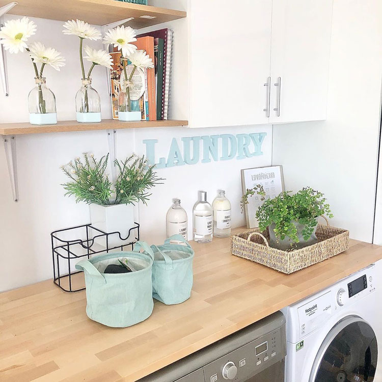 Cute Laundry Room with Cabinet and Shelf