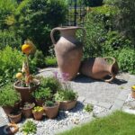terracotta vases and pot plants backyard