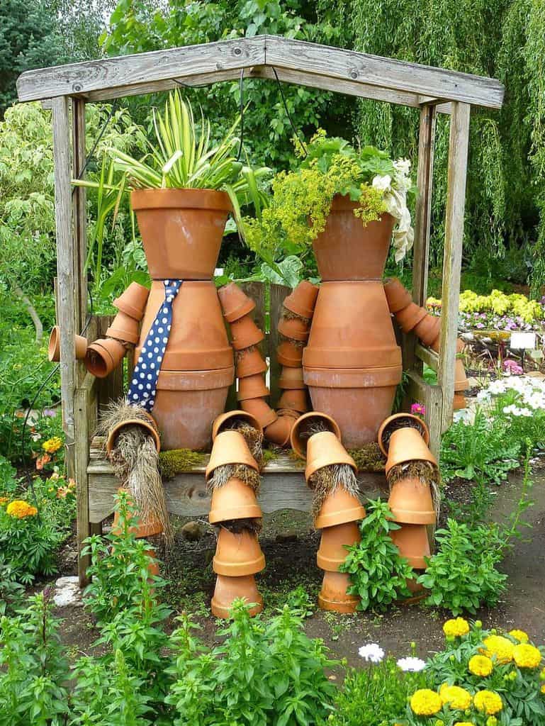 decorative-planters-and-pots-2-garden-decor-ideas terracotta pots resembling humans in backyard