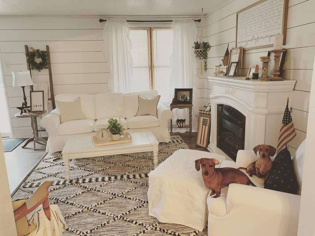 diy-fireplace-wall-ideas-diyobsessedhome rustic living room white fireplace shiplap walls sofa coffee table american flags dogs