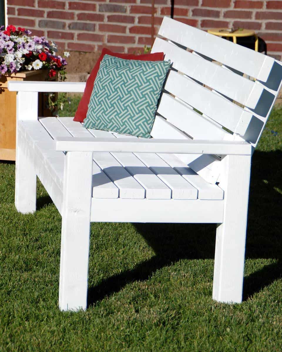 diy-garden-bench-ideas-thecreativemom painted white wood bench with pillows