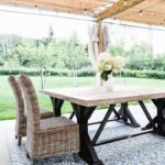 deck patio with wood pergola and string lights