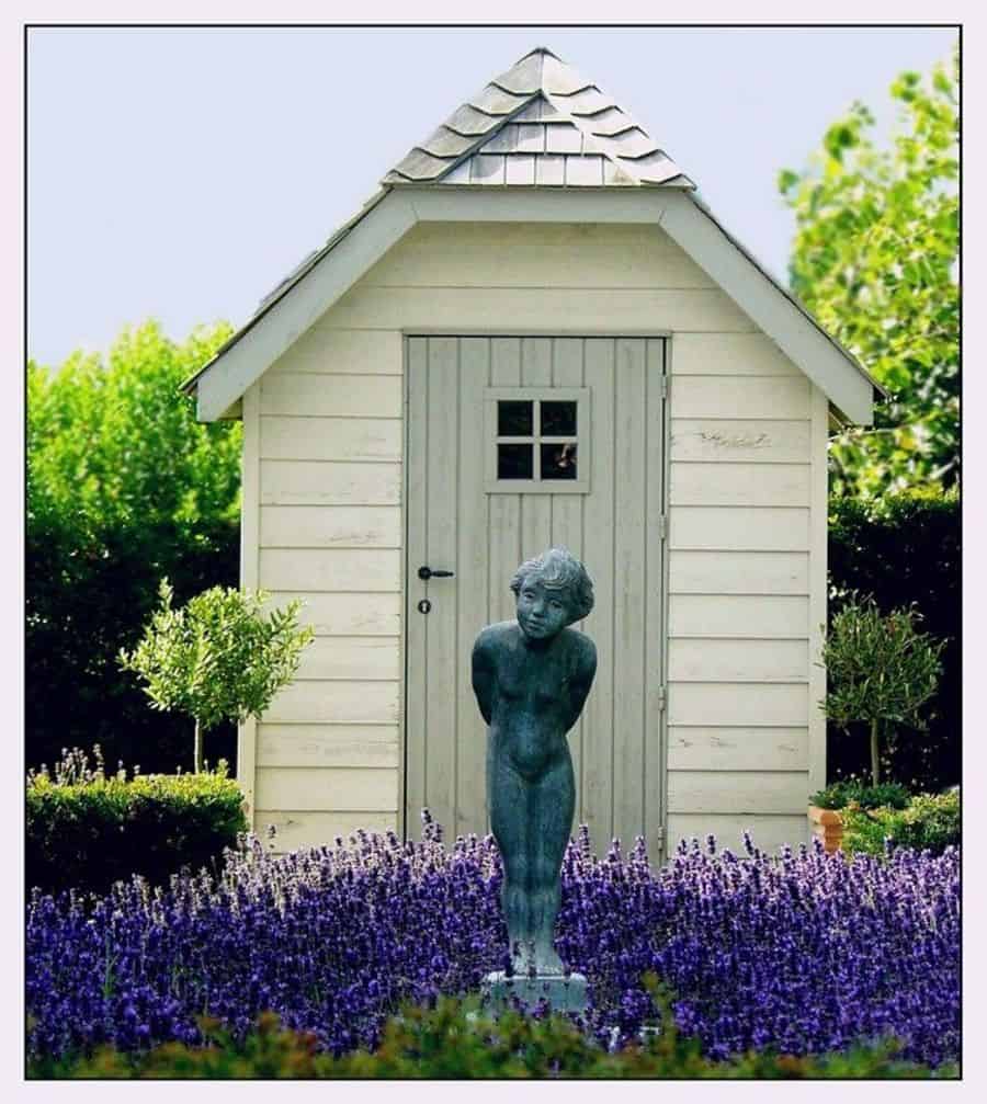 garden-statue-3-garden-decor-ideas small white wood shed blue woman garden statue lavender