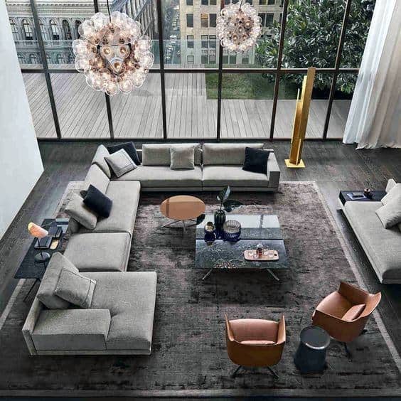 luxury apartment living room with gray sofa and floor to ceiling windows