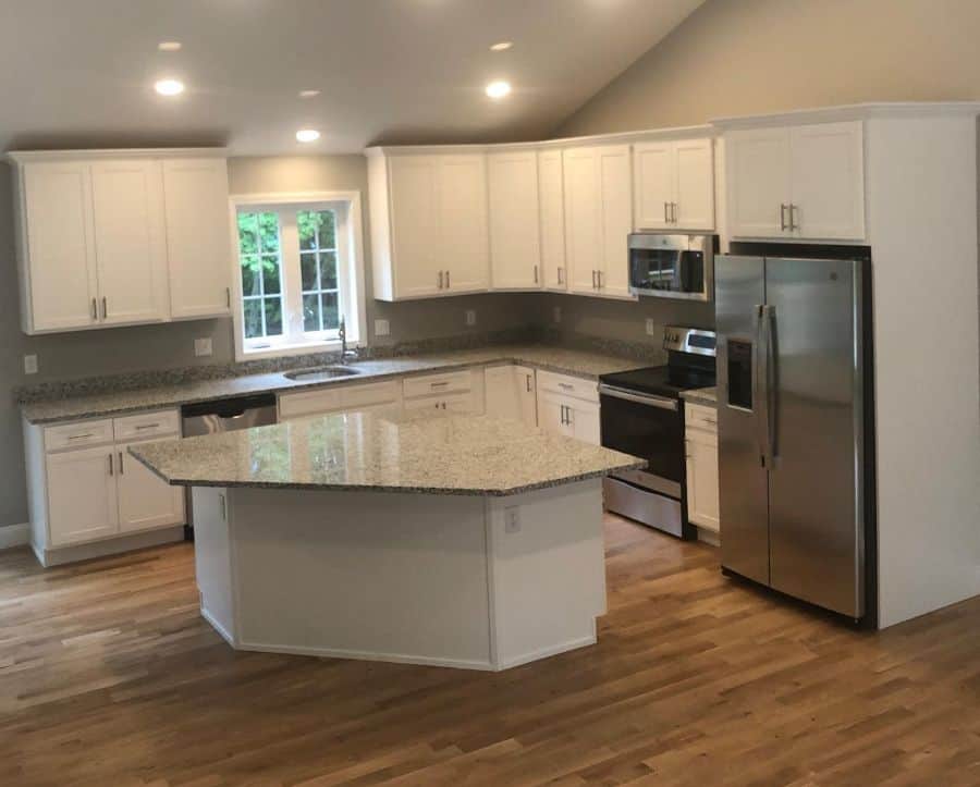 white kitchen cabinet with island granite countertop