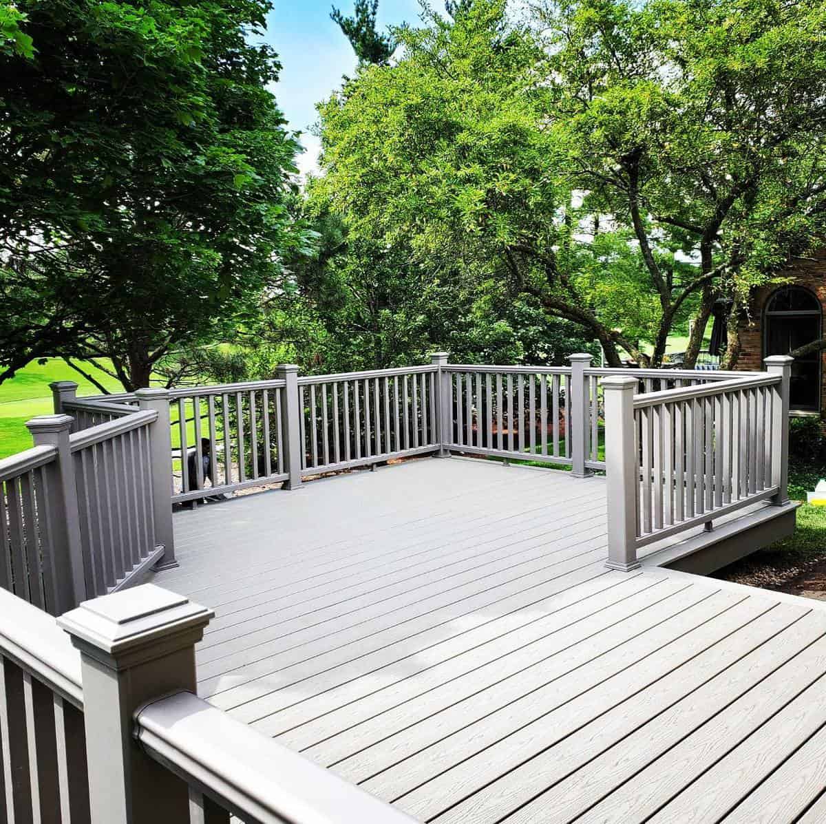 gray deck railing trees