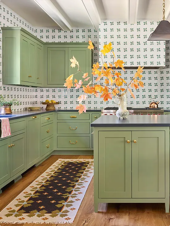 Green clover motif on small white tile in a garden-inspired kitchen