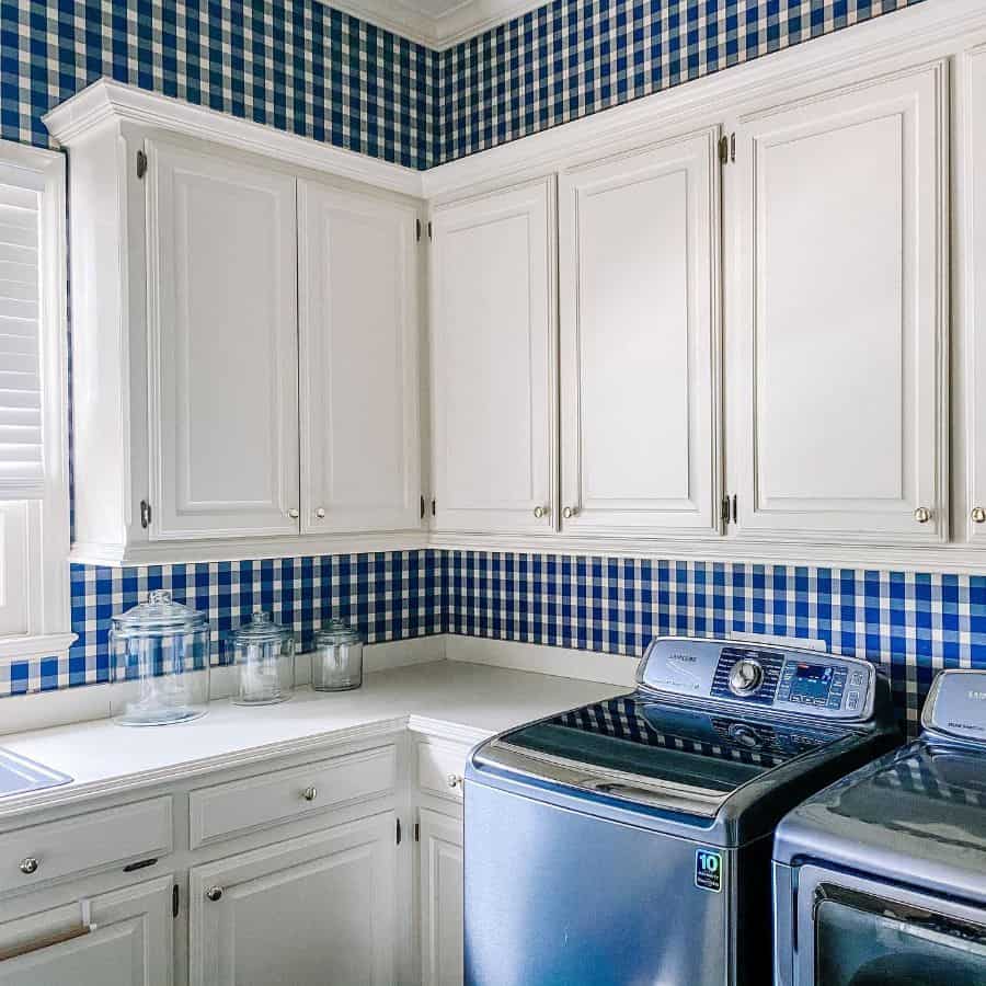 country style laundry white cabinets blue check wallpaper