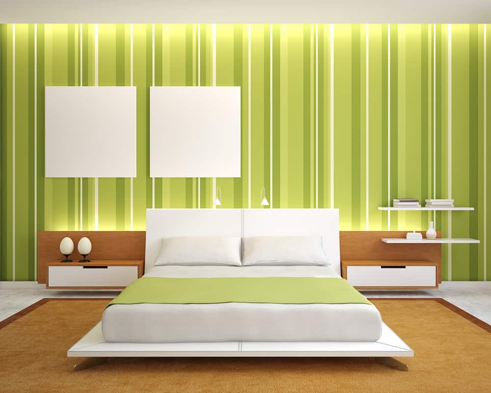 interior-green-bedroom-ideas-3 Modern bedroom with a green striped wall, white bed, and brown accents; minimalistic decor and lighting