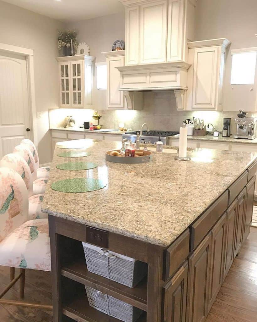 white cabinet kitchen with granite countertop island
