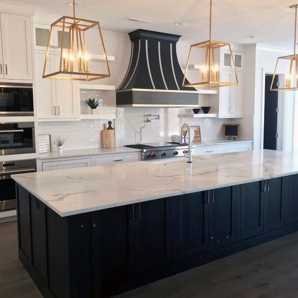 large black cabinet island with marble countertop in modern kitchen
