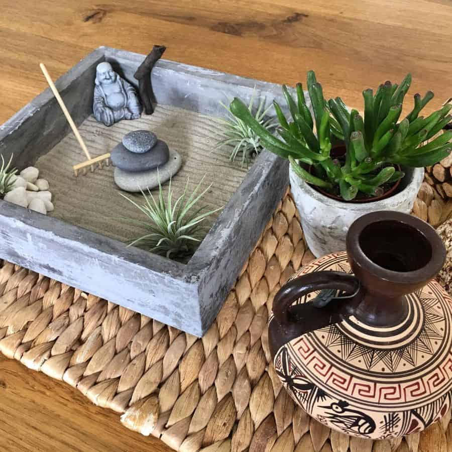 mini-zen-garden-ideas-smallspacebigpassion small japanese rake garden with buddha statue and succulent