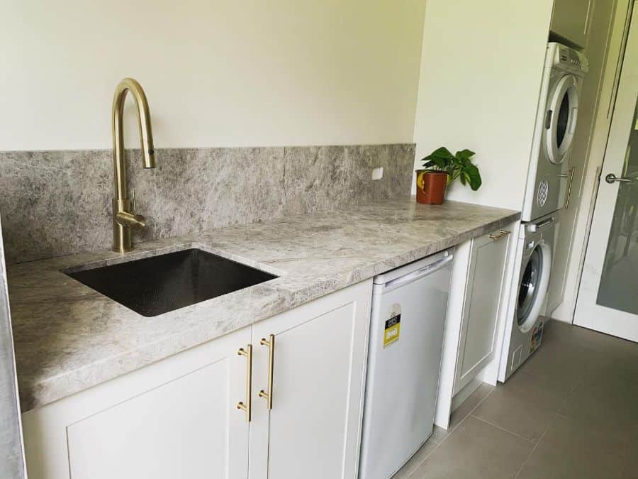 narrow-laundry-room-sink-ideas-seabassplumbing small narrow laundry stacked washer and dryer