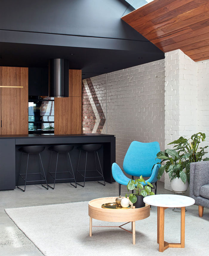 natural wood accents black kitchen cabinets