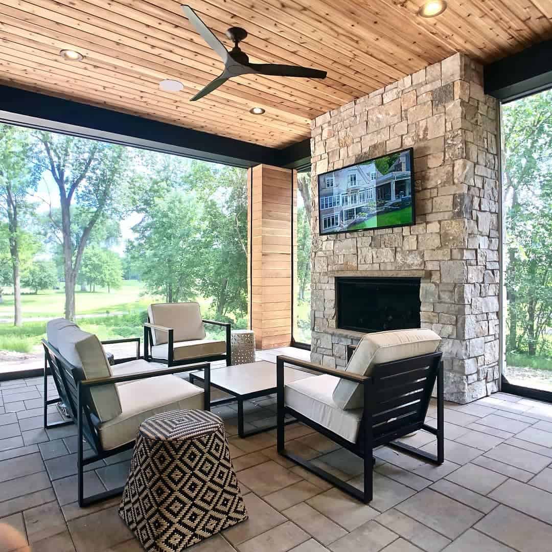 outdoor-patio-enclosure-ideas-raiseurroof enclosed paver patio with stone fireplace