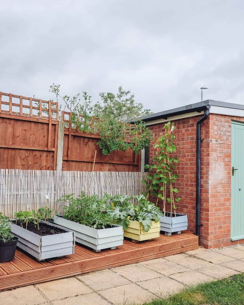 small planter boxes on wood deck