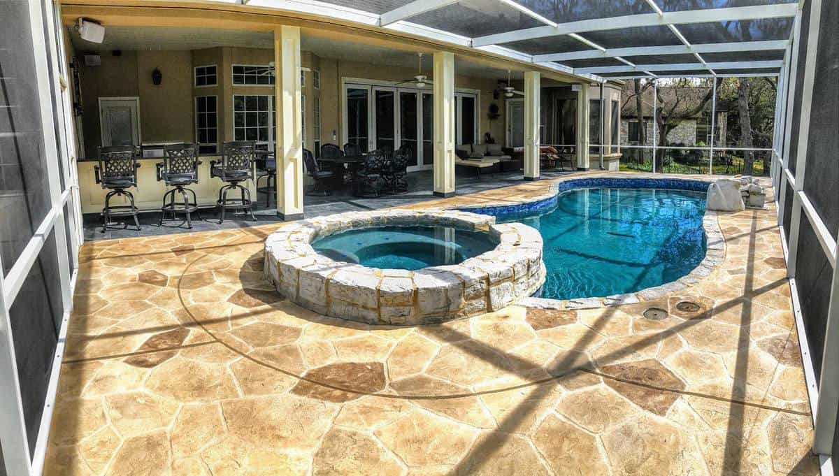 pool-patio-enclosure-ideas-sundek-nashville stone paver patio pool enclosure