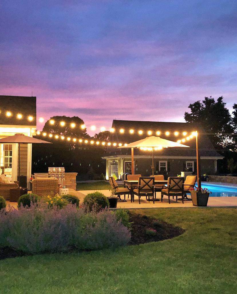 pool-patio-lighting-ideas-homeonnativetrail large patio with bbq and string lights